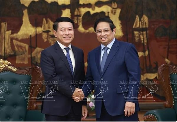 政府总理范明政：越南愿为老挝分享国有企业改革与重组经验