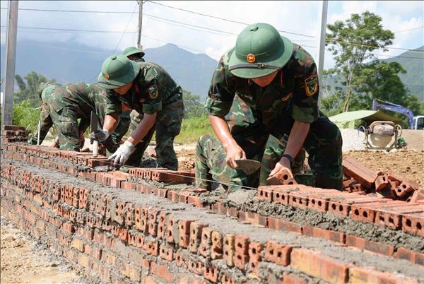 Troops Race to Build New Homes for Muong Than Flood Victims
