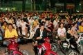 Many fans who can not park their motorbikes have to stand right in the streets to watch the match on another TV screen provided by the Organization Board.