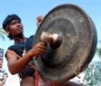 A Ba Na ethnic artist performs the gongs of his group.