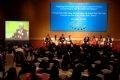 Former President Bill Clinton has a discussion with a group of young Vietnamese people about the prevention of HIV/AIDS.