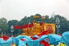 The float carries the symbolic dragon of the Ly Dynasty.