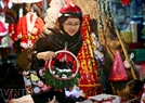 A Hanoi girl buys decorative items for Christmas.