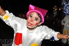 A funny clown performs on the street.