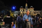 Tourists on the streets at night in Ho Chi Minh City.