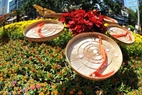 Miniature flowers and Quai Thao hats on Nguyen Hue Flower Street.
