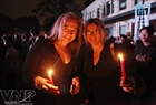 Foreign tourists participate in the event in response to Earth Hour in Hanoi. Photo: Cong Dat