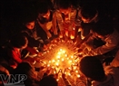 Young people shape candles into a five-wing star. Photo: Cong Dat
