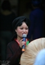 A female Quan Ho singer perform on Hang Dao Street in Hanoi Old Quarter.
