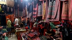 Colourful brocade products are sold at a market in Sapa.