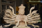 A statue of the Goddess of Mercy before being red-lacquered. 