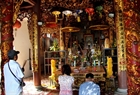 Visitors offer incenses to pray for peace in Nam Hai Than Vuong Temple on Hon Dau Island.