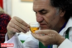 Turkish examiner Hasan Oner enjoys tea prepared by the contestants. Photo: Tran Cong Dat/VNP